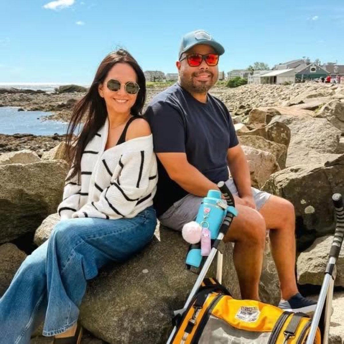 Shey and Luis on the rocks by the coast