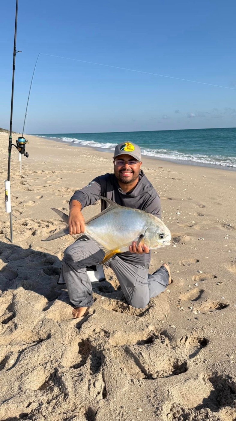 Luis with a fresh catch on the beach