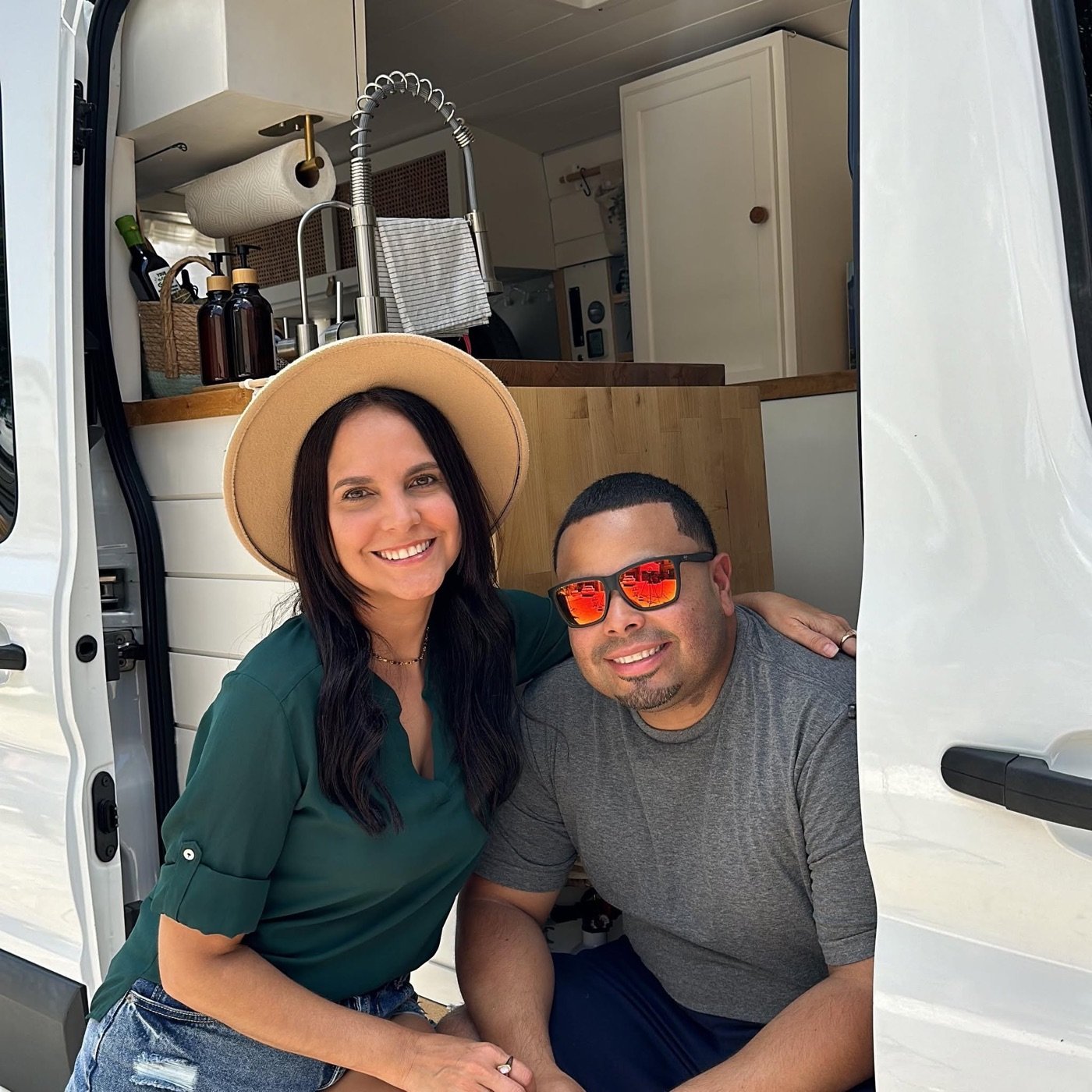 Shey & Luis inside their self-built camper van